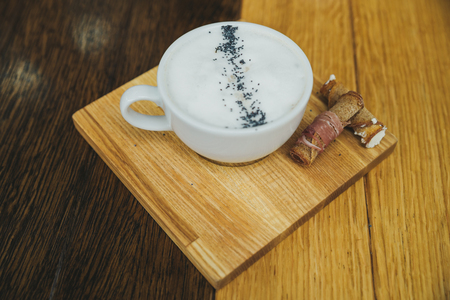 cheese cream soup close up on wooden cafe tableの写真素材