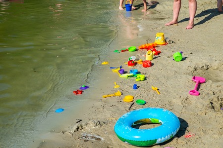 inflatable ring kids toys at sand beach close up. nobody