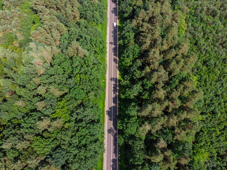 aerial view of straight highway. sunny day. car travel concept