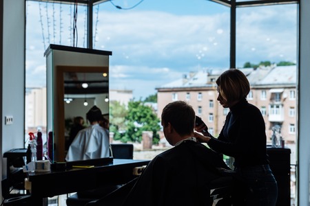 LVIV, UKRAINE - July 3, 2018: haircut in beauty saloon.のeditorial素材