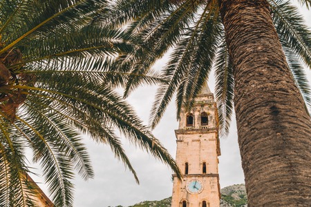 church tower in perast, montenegro. clouds on backgroundの写真素材