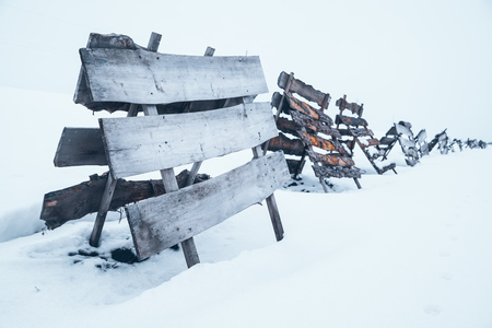 hay dryers in snow. white snowed field. winter seasonの写真素材