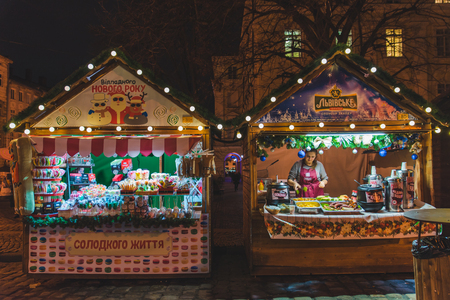 LVIV, UKRAINE - December 12, 2017: christmas festival at lviv square. market with street food conceptのeditorial素材