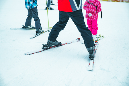 BUKOVEL, UKRAINE - December 9, 2018: legs of skiing people close up. winter vacationのeditorial素材