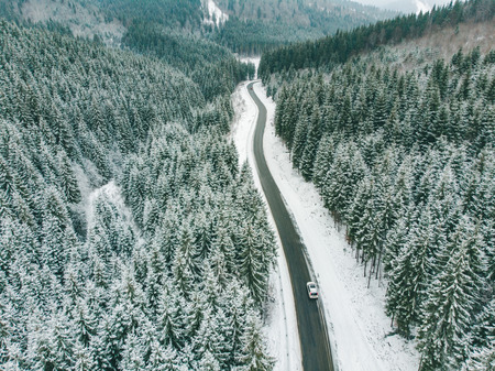 beautiful view of snowed freeway in mountains road trip. perspectiveの写真素材