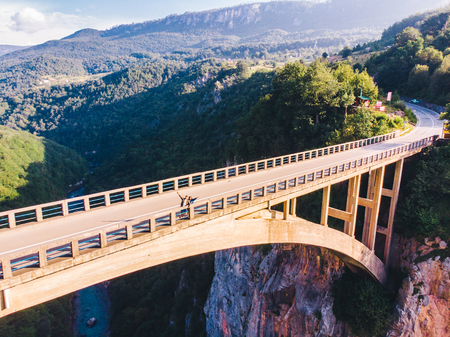 highway with high bridge cross canyon. aerial viewの写真素材