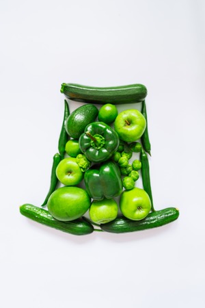 green hat of green fresh fruits and vegetables for patrick dayの写真素材