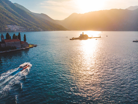 aerial view of sunset above sea bay. mountains on background