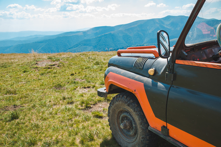 off road in mountains. suv car travel concept. summer timeの写真素材