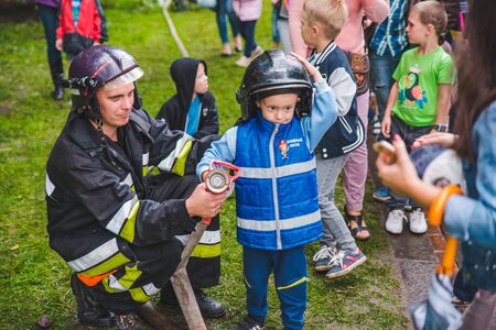LVIV, UKRAINE - July 17,2018: families with kids walking by park. professional kids day holidaysのeditorial素材