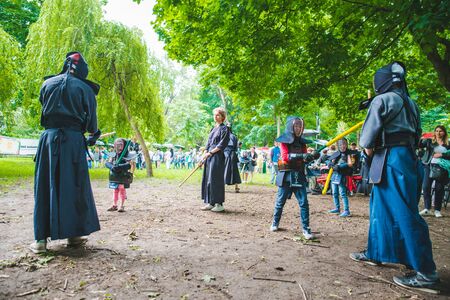LVIV, UKRAINE - July 17,2018: families with kids walking by park. professional kids day holidaysのeditorial素材
