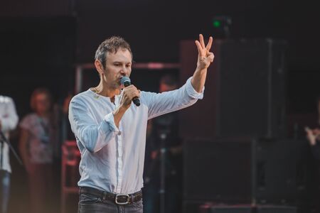LVIV, UKRAINE - June 18, 2019: Vakarchuk at stage talking in microphone. political