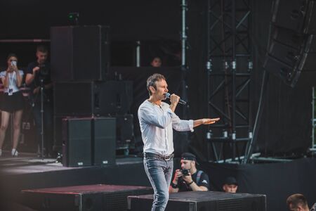 LVIV, UKRAINE - June 18, 2019: Vakarchuk at stage talking in microphone. politicalのeditorial素材