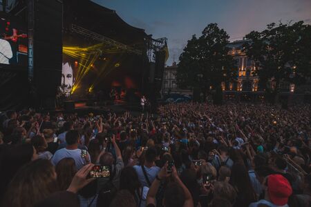 LVIV, UKRAINE - June 18, 2019: wide angel crowd before rock stage at city square. copy spaceのeditorial素材