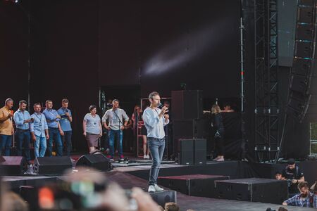 LVIV, UKRAINE - June 18, 2019: Vakarchuk at stage talking in microphone. politicalのeditorial素材