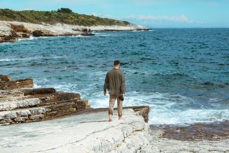 professional photographer shooting seascape. copy spaceの写真素材