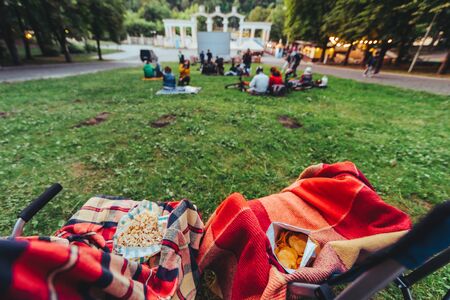 two folding chairs with cooling bag with beer and snacks in open air cinema copy spaceの写真素材