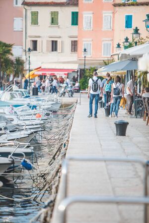 ROVINJ, CROATIA - June 8, 2019: city quay people walking enjoying the view of old touristic city. sea bay harborのeditorial素材