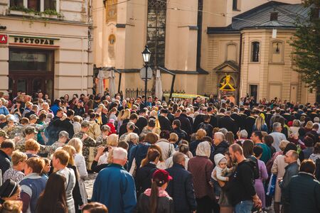 LVIV, UKRAINE - October 7, 2018: religious procession at city streets. nuns and monksのeditorial素材