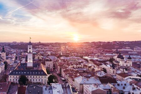 aerial view of sunset above european city. old gothic architectureの写真素材