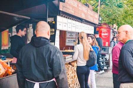 PRAGUE, CZECH REPUBLIC - September 22, 2018: people buying street food outdoorsのeditorial素材