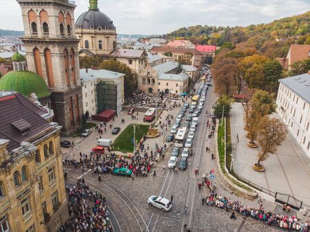 LVIV, UKRAINE - October 7, 2018: aerial view religious procession at city streets. nuns and monksのeditorial素材
