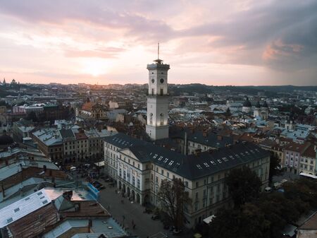 aerial view of lviv bell clock tower on sunset overcast sky evening time