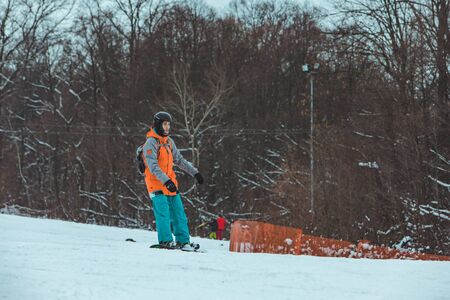 LVIV, UKRAINE - January 12, 2019 - man snowboarding down hill. winter leisureのeditorial素材