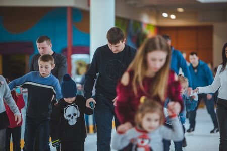 LVIV, UKRAINE - February 3, 2019: people skating on ski rink in city mall. weekend leisureのeditorial素材