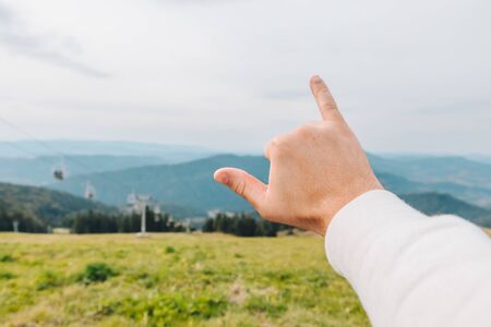happy symbol of success showing on the top of the peak hiking conceptの写真素材