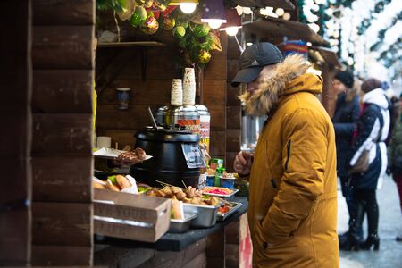 Lviv, Ukraine - January 4, 2019: Fast food fest outdoors winter time copy space