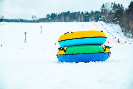 snow tubing rings close up. hill on backgroundの写真素材