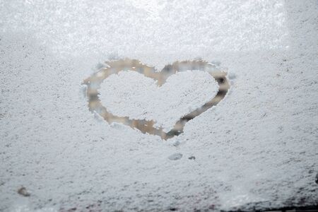 heart love symbol at frozen glassの写真素材