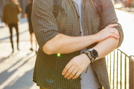 smart watch at men wrist outdoors sunset time casual accessoryの写真素材