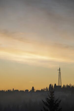 silhouette of village in mountains on sunrise rural sceneの写真素材