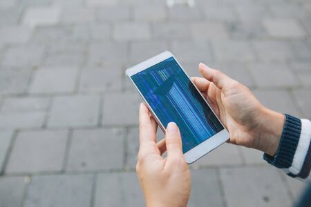 hands holding phone with broken cracked screen. gadgets insuranceの写真素材