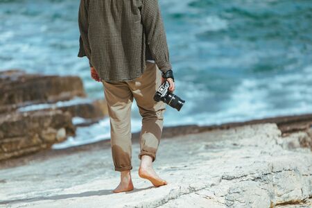 professional photographer shooting seascape. copy spaceの写真素材