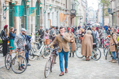 Lviv, Ukraine - May 4, 2019: city birthday festival people ride old retro bicycles. copy spaceのeditorial素材