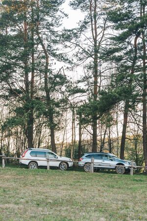two suv cars parked at countryside road. copy spaceの写真素材