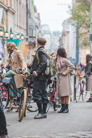 Lviv, Ukraine - May 4, 2019: city birthday festival people ride old retro bicycles. copy spaceのeditorial素材