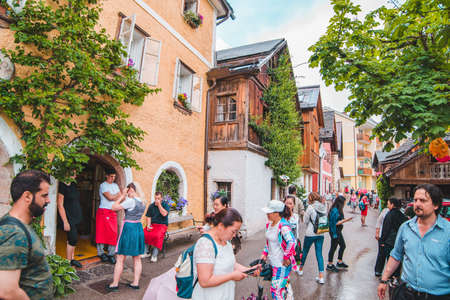 Hallstatt, Austria - June 15, 2019: view of tourist city street overloaded with people. travel conceptのeditorial素材