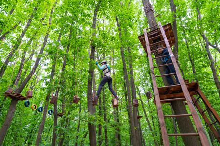 couple having fun at rope park. sports activitiesの写真素材