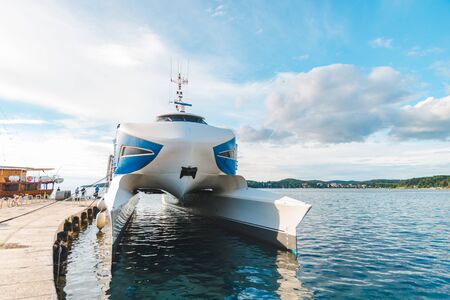 sea catamaran at dock summer sunny day. vehicle modeの写真素材