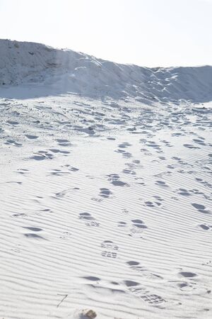 view of people steps at sand. hot desert. close up. copy space