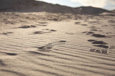 view of people steps at sand. hot desert. close up. copy space