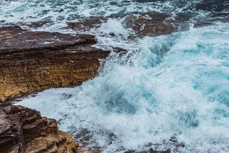 view of rocky sea beach in storm weather. copy space. backgroundの写真素材