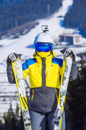 woman in ski equipment on the top of the hillの写真素材