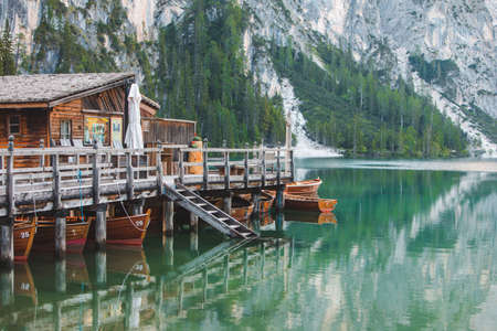 view of wooden dock boats station at braies lake in Italy. dolomites alpinesの写真素材