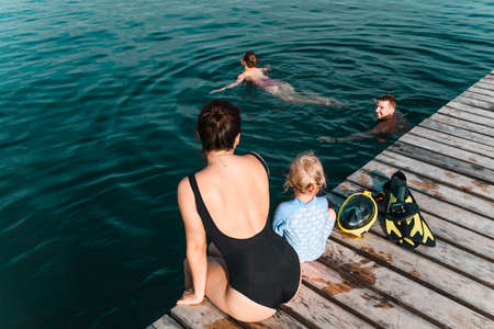 friends swimming in lake. summer sunny day. enjoymentの写真素材