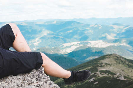 legs on the top of the peak. top spot. copy space